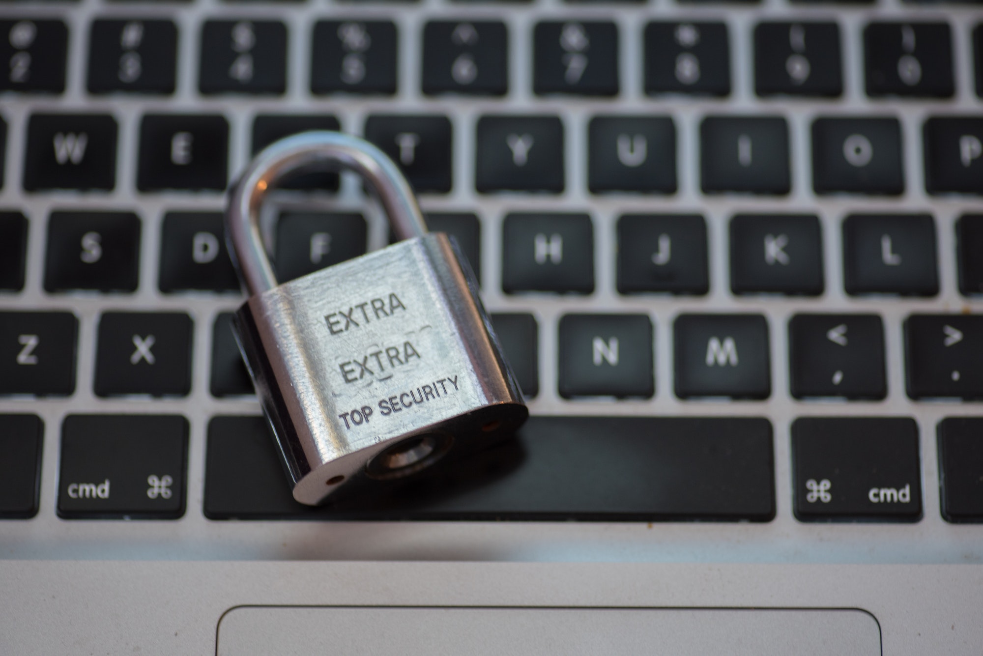 Lock pad isolated against keyboard of laptop depicting internet security